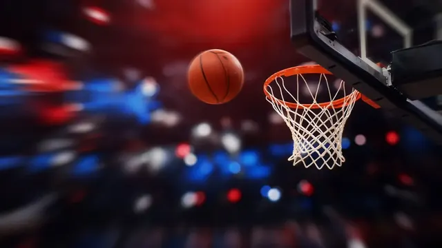 Illustration of a basketball dropping through a hoop with red and blue arena lights blurred behind