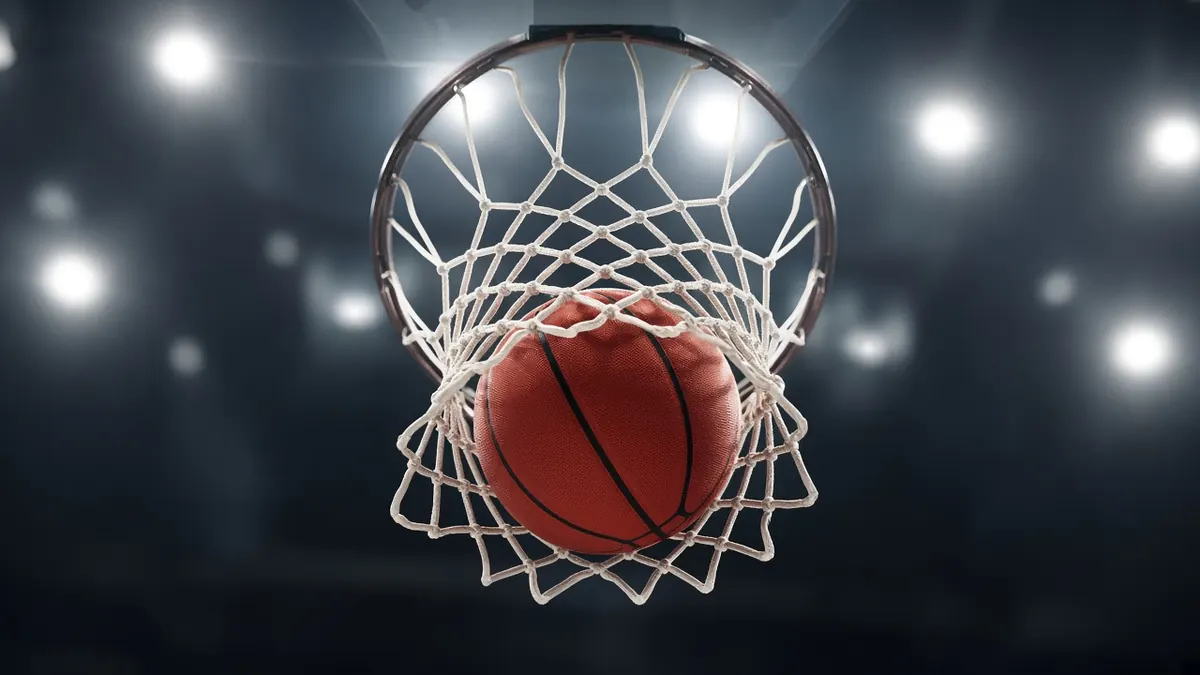 Illustration of a basketball swishing through a net, seen from directly below the rim