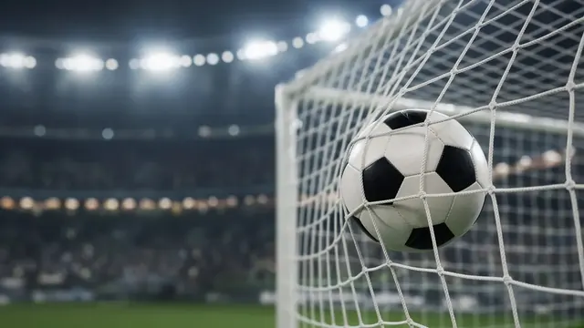 Illustration of a soccer ball hitting the back of a goal net under stadium floodlights at night